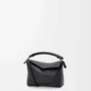 Borsa Mini Puzzle Edge in morbida pelle di vitello martellata Black