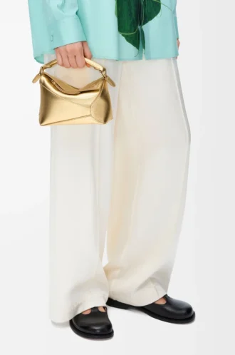 Borsa Mini Puzzle Edge in pelle di agnello laminata Gold