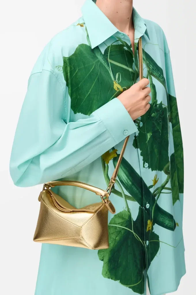 Borsa Mini Puzzle Edge in pelle di agnello laminata Gold Borsa Mini Puzzle Edge in pelle di agnello laminata Gold