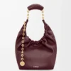 Borsa Squeeze piccola in morbida pelle di agnello nappa Dark Burgundy Borsa Squeeze piccola in morbida pelle di agnello nappa Dark Burgundy