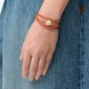 Bracciale Pebble in pelle di vitello arancione/oro