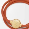 Bracciale Pebble in pelle di vitello arancione/oro