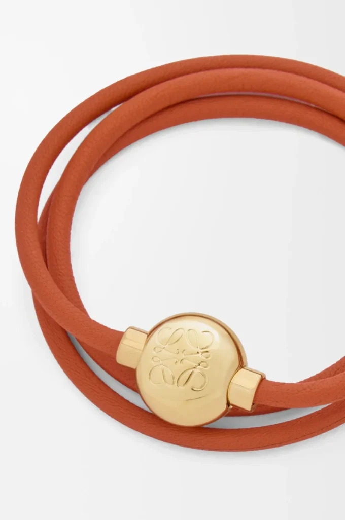 Bracciale Pebble in pelle di vitello arancione/oro