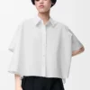 Camicia trapezio a maniche corte in cotone bianco Camicia trapezio a maniche corte in cotone bianco