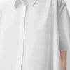 Camicia trapezio a maniche corte in cotone bianco Camicia trapezio a maniche corte in cotone bianco