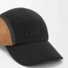 Cappellino da campeggio in tela e pelle scamosciata nero/oro scuro Cappellino da campeggio in tela e pelle scamosciata nero/oro scuro