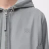 Giacca con cappuccio in cotone grigio chiaro Giacca con cappuccio in cotone grigio chiaro