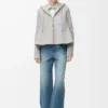 Giacca con cappuccio in shearling grigio melange chiaro