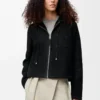 Giacca con cappuccio in shearling Nero Giacca con cappuccio in shearling Nero