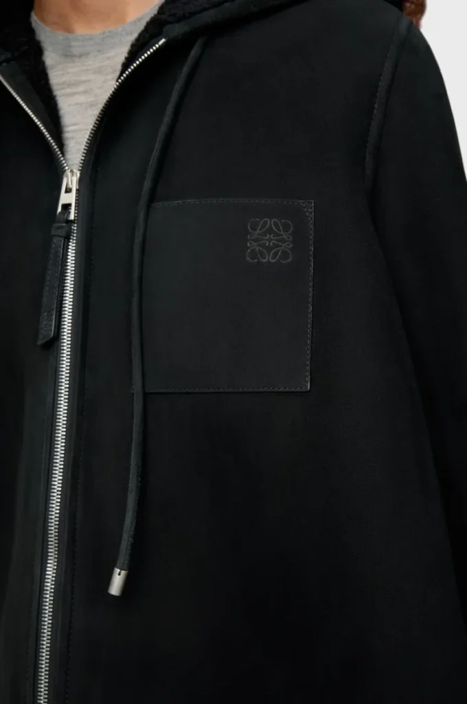 Giacca con cappuccio in shearling Nero Giacca con cappuccio in shearling Nero