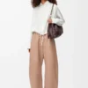 Pantaloni a zampa in pelle di agnello nappa Beige Pantaloni a zampa in pelle di agnello nappa Beige