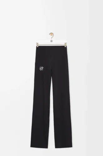 Pantaloni morbidi a zampa in jersey tecnico nero Pantaloni morbidi a zampa in jersey tecnico nero