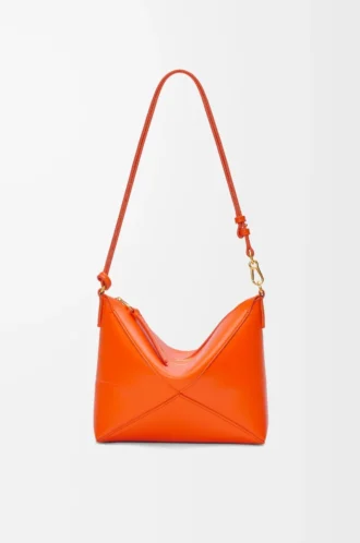 Pochette Puzzle Fold in pelle di vitello nappa lucida Vivid Orange