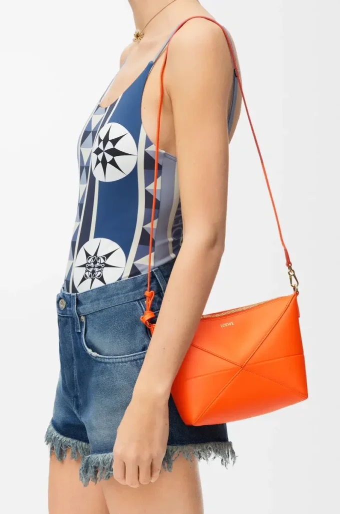 Pochette Puzzle Fold in pelle di vitello nappa lucida Vivid Orange Pochette Puzzle Fold in pelle di vitello nappa lucida Vivid Orange