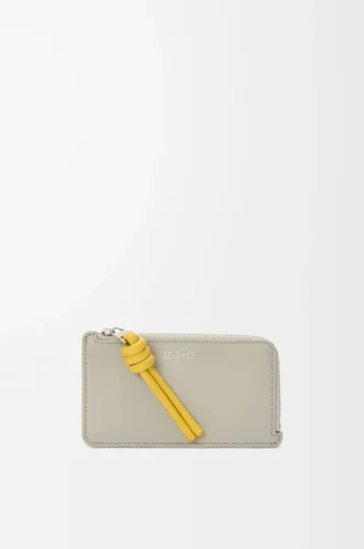 Portacarte e portamonete con nodo in pelle di vitello nappa lucida Shell Grey/Dandelion