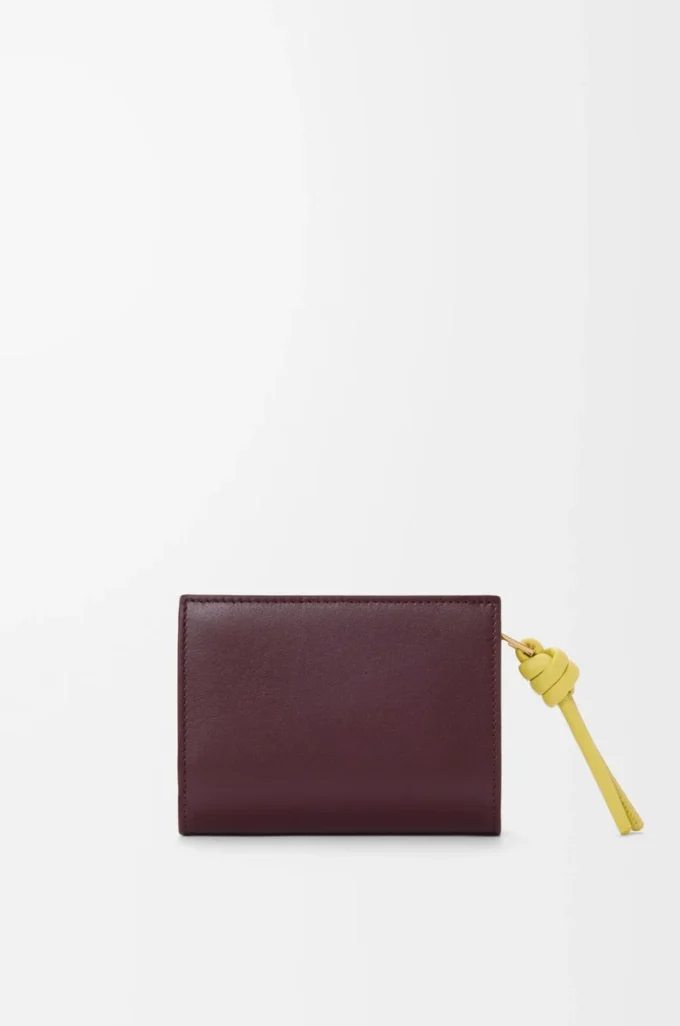 Portafoglio compatto con nodo in pelle di vitello nappa lucida Dark Burgundy/Light Citrine