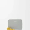 Portamonete con zip in pelle di vitello nappa lucida grigio conchiglia/dente di leone