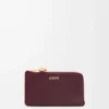 Portamonete Pebble in pelle di vitello nappa lucida Burgundy
