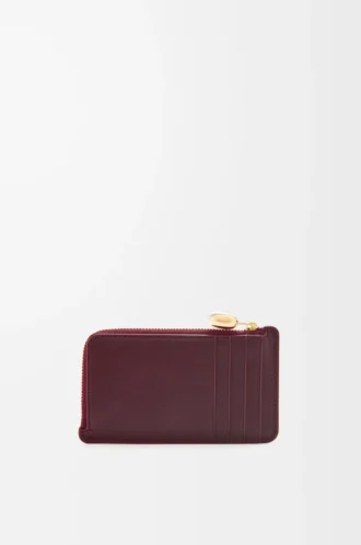 Portamonete Pebble in pelle di vitello nappa lucida Burgundy