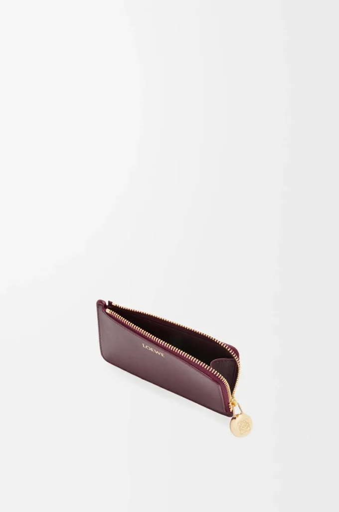 Portamonete Pebble in pelle di vitello nappa lucida Burgundy