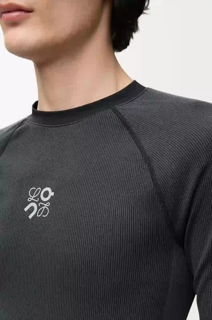 Top a maniche lunghe in jersey tecnico Nero